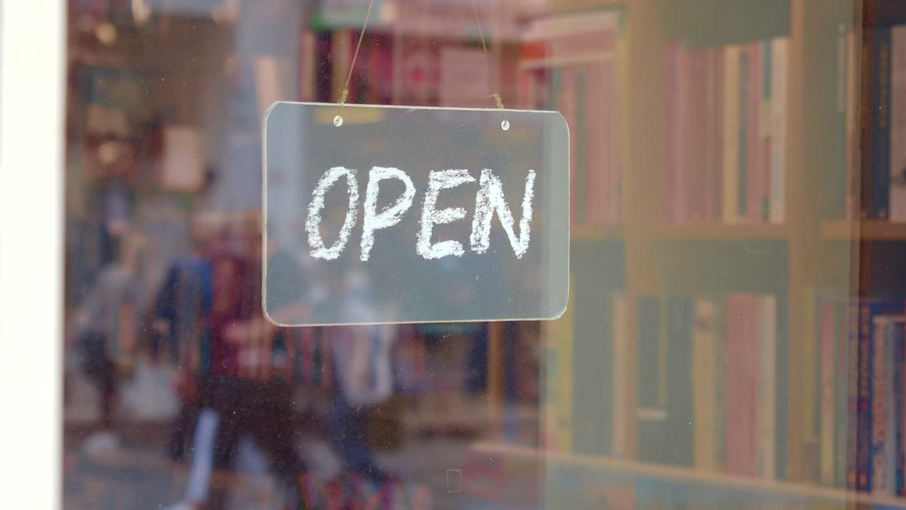 Open Sign in Bookstore Window