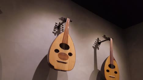 middle eastern oud displayed on a wall | musical instrument and traditional tool featured in turkish and arabic music