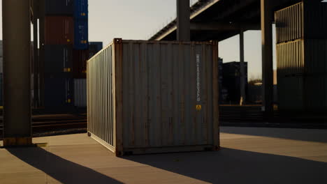shipping container in a cargo yard at sunset