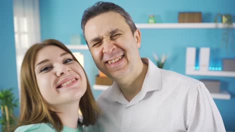 Father-and-daughter-taking-selfie-with-phone.