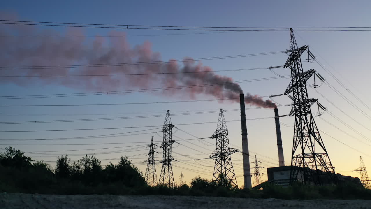 High voltage power lines station. High voltage electric transmission pylon towers