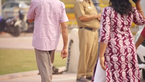 Indian-policeman-using-mobile-phone