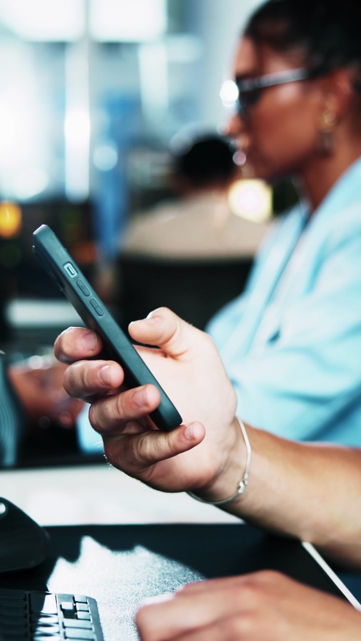 Person Using Smartphone in Modern Office Setting