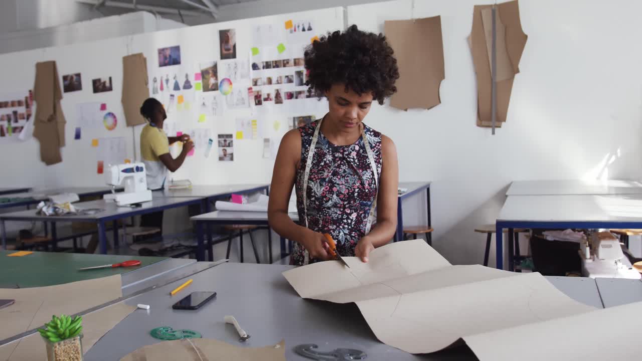 Mixed race woman working in creative office