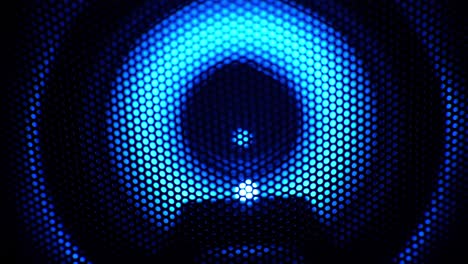 Speaker-with-blue-neon-light-flashing,-music-festival-concept