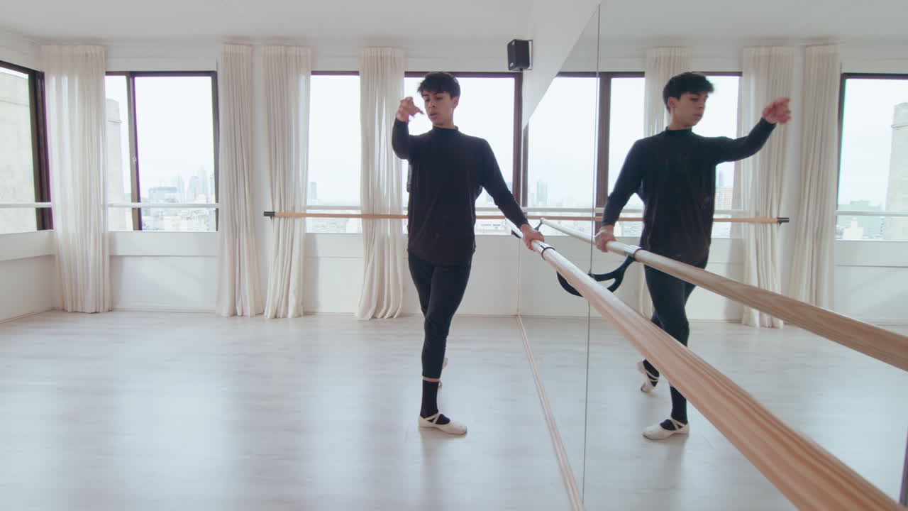Male Ballet Dancer Training at the Barre