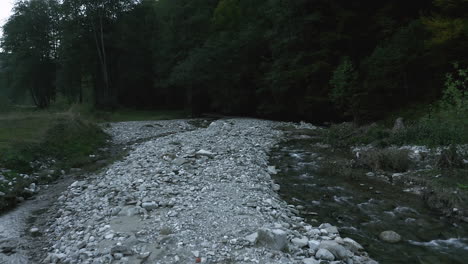 Small-Stream-Surrounded-With-Rocks-And-Lush-Forest-At-Bucegi-Mountain-In-Prahova,-Romania