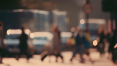 anonymous crowd of people walking cycling bicycles commuters london city street slow motion