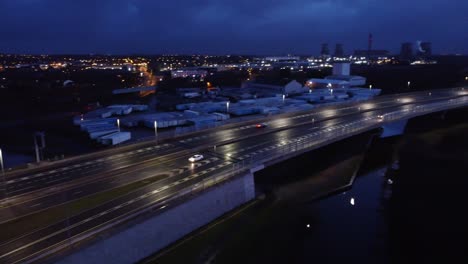 aerial view modern illuminated quiet highway lanes road intersection traffic fast left pan