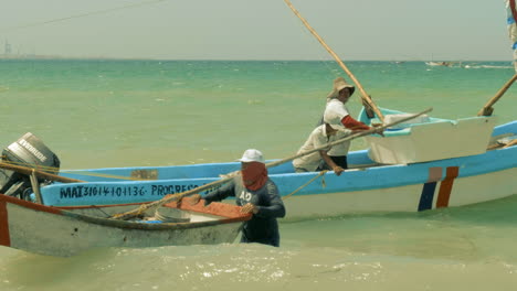fishermen and boats at puerto progreso life in merida yucatan mexico. progreso yucatan january 7, 2019