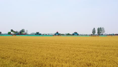 Steady drone shot of driverless autonomous fleet road construction during the day next to a field in Bozhou, Anhui province, China
