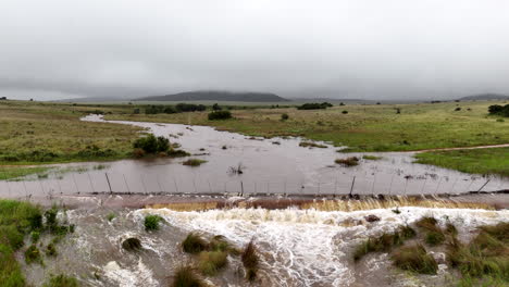 aerial view of rural countryside farm fence compromised by heavy floodwater