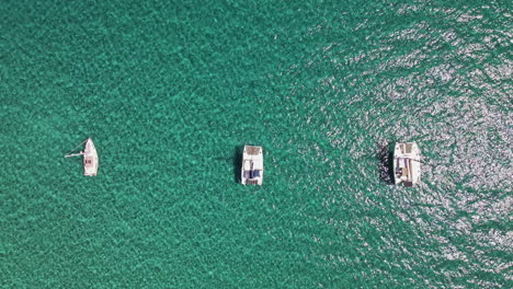 aerial white boats standing at tropical clear blue sea