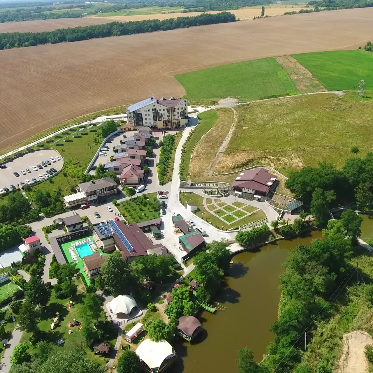 Aerial view of countryside vacational resort. Drone shot of summer sunny landscapes