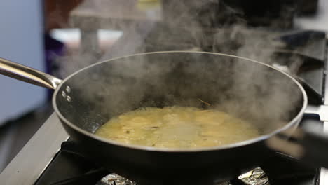 cooking raviolis in a pan