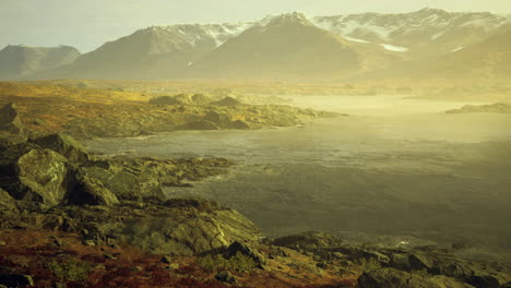 breathtaking morning mist rises over tranquil lake in rugged mountain landscape