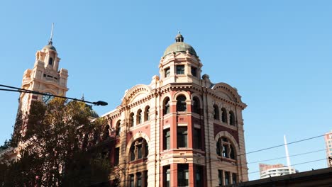 iconic building with passing tram and traffic