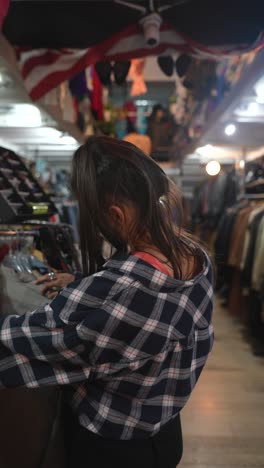 woman shopping in a vintage clothing store