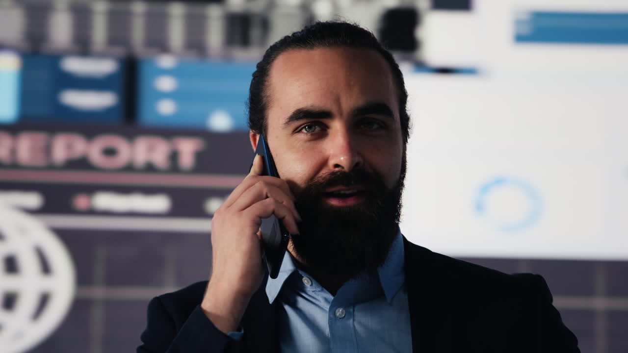 Businessman answering a smartphone call to evaluate digital analytics