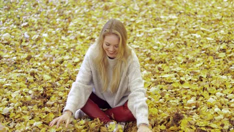 Woman-throwing-leaves