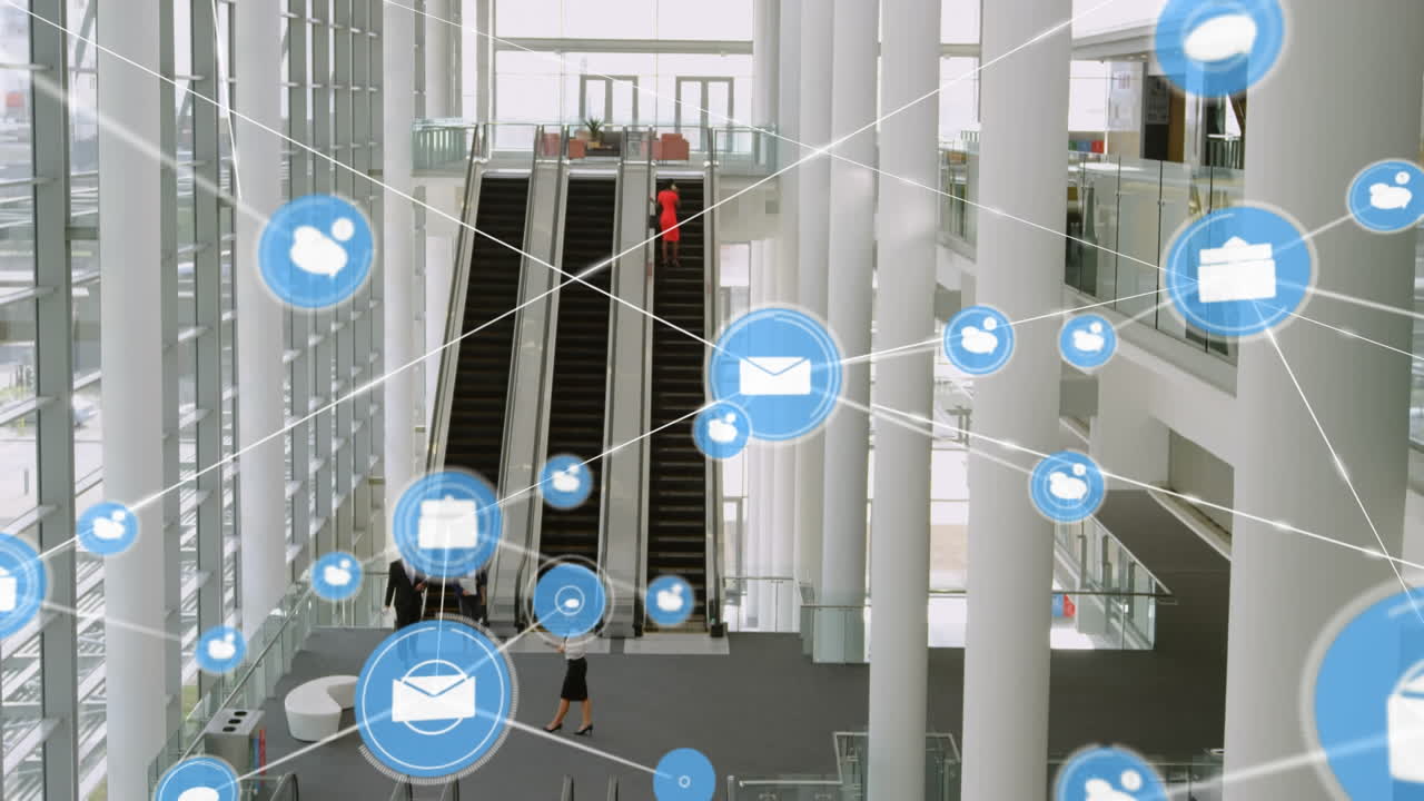 Animation of network of digital icons over aerial view of escalators at modern office