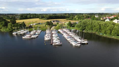 aerial view of jachts moored to a jetty