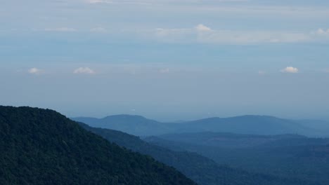 time-lapse of this picturesque landscape khao yai national park views as the clouds move to the right and then shadows and sunlight fall on the forests, thailand