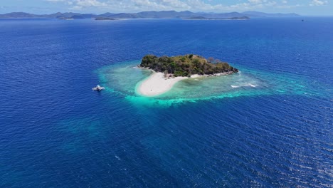 drone footage of a distant small tropical island near palawan in the philippines