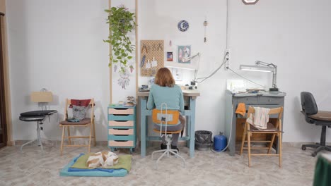 jewelry designer in her workshop