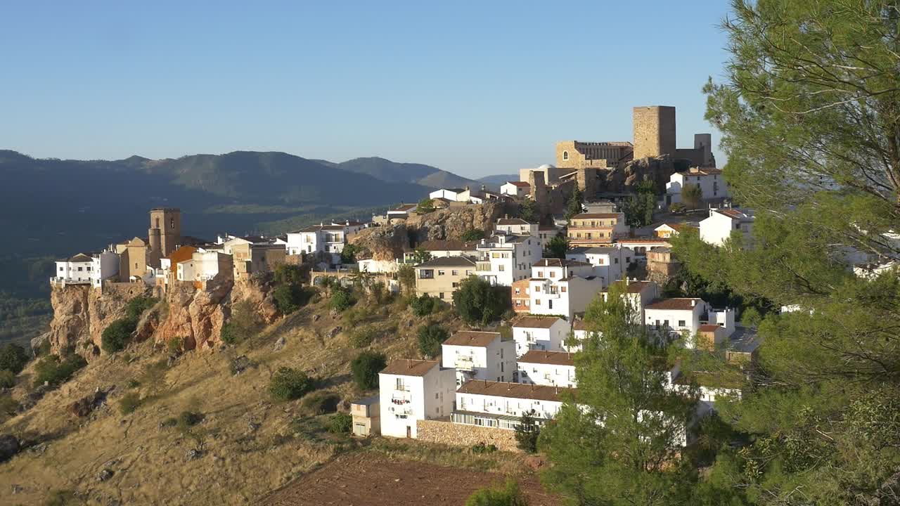 Panoramic view of the village of Hornos de Segura, in the province of Jaén. Hornos Castle, the church, and the white houses rise from the cliff, dominating the landscape of the Sierra de Segura