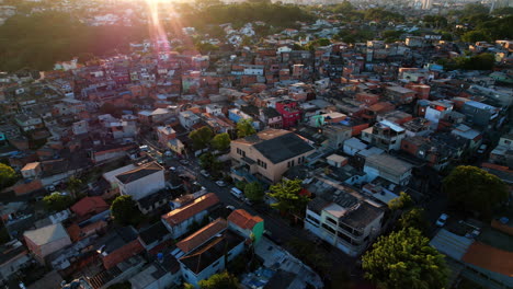aerial view of a protestant church in middle of a favela, sunset in sao paulo, brazil