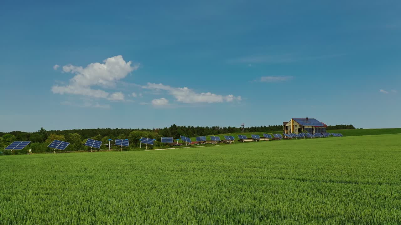 Innovative solar panels on field. Agricultural landscape in spring and photovoltaic solar cells to receive green energy from the sun. Ecological electricity.