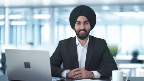 happy sikh indian businessman smiling