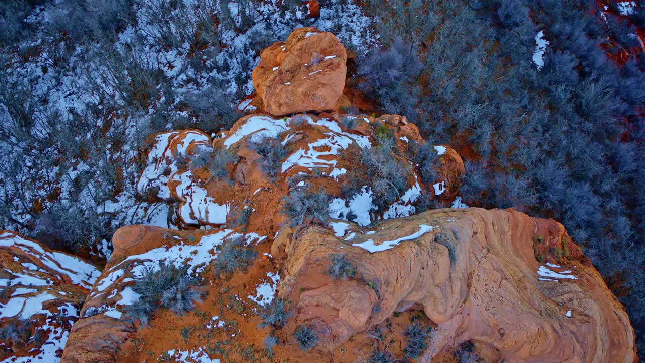 The drone’s gaze sweeps across the vibrant, shape-shifting terrain of the Southwestern desert.
