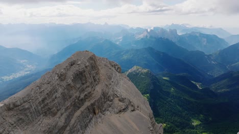 Spectacular-drone-shot-above-dolomites-mountains-during-sunny-day-and-green-valley---Dolomites,Italy