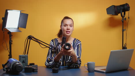 social media star reviewing two camera lenses