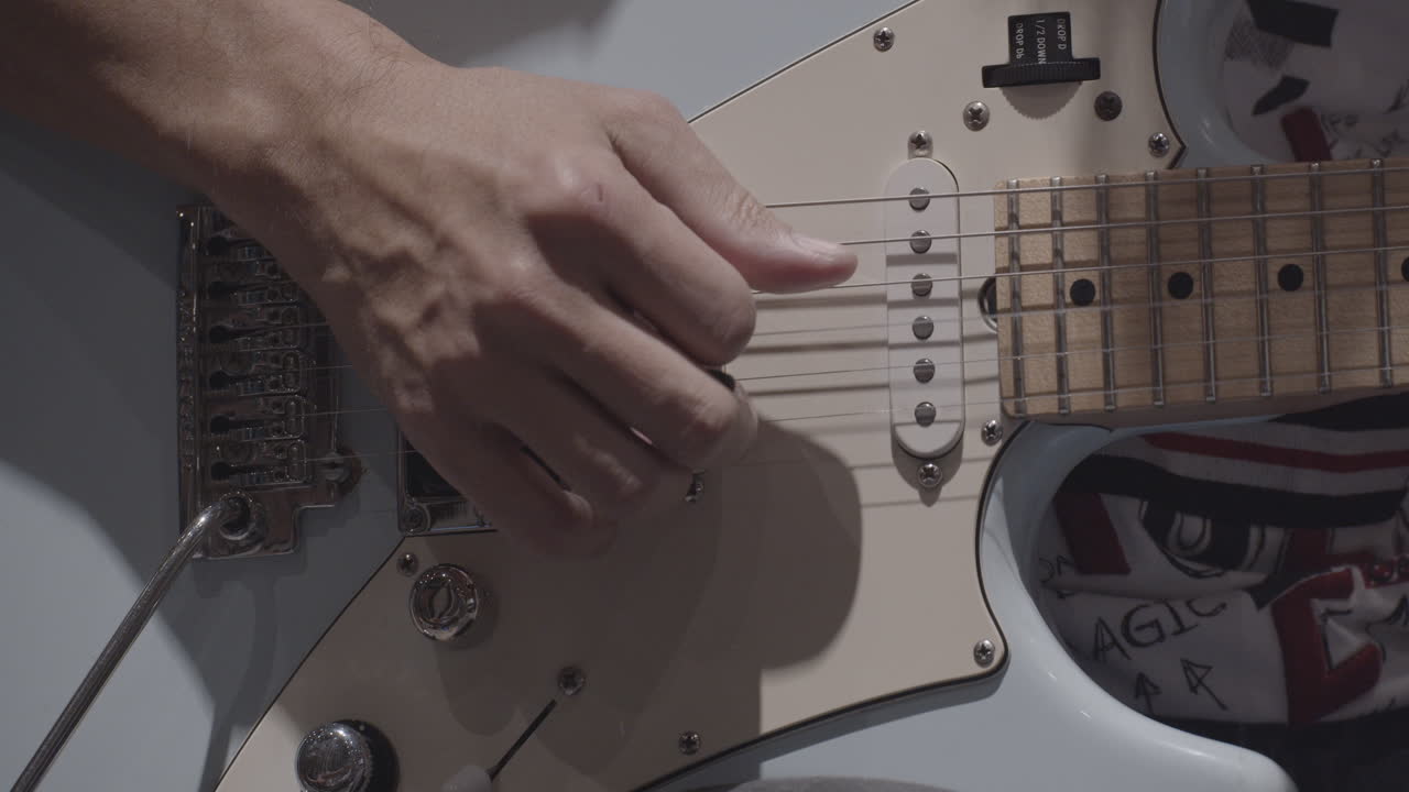 Close-up Man Playing Electric Guitar