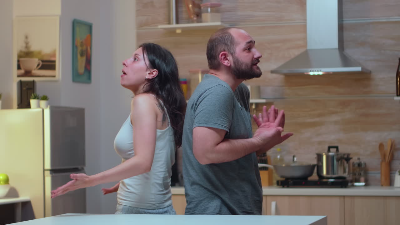 Couple fighting back to back