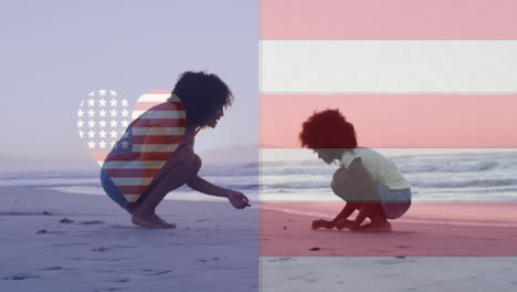 Animation of american flag and heart shape over african american mother and child playing at beach