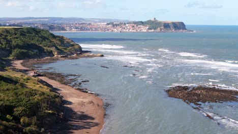 coastal town landscape with cliffs and ocean waves