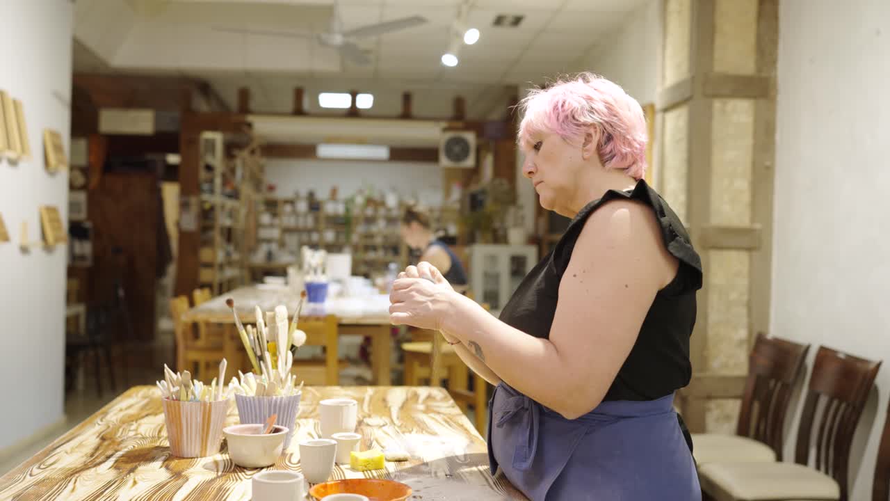 Woman Working on Pottery in Art Studio
