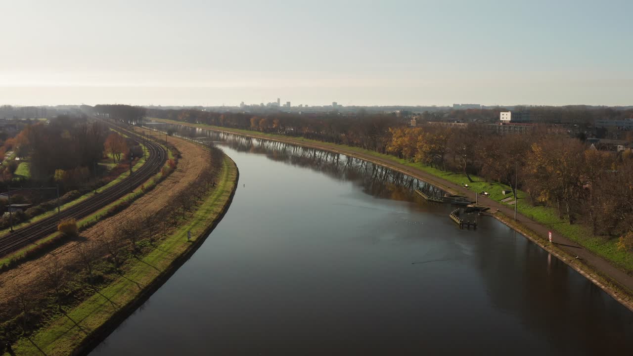 Aerial shot of a canal going through the city of Middelburg towards Vlissingen in the Netherlands. Sunny day with no wind