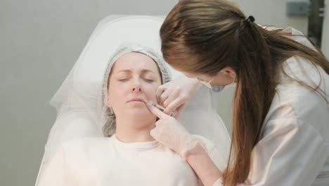 cosmetologist performing facial injection procedure