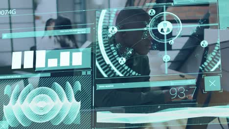 animation of diverse data over african american man working on computer in office