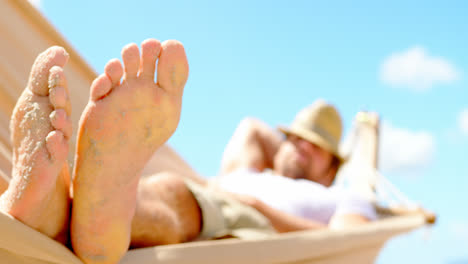 Bottom-view-of-young-caucasian-man-sleeping-on-the-hammock-4k