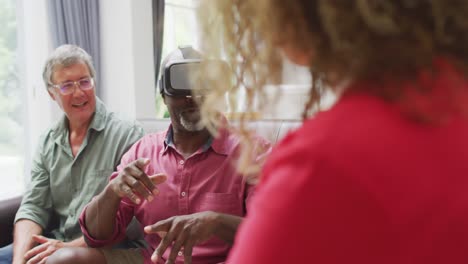 Animation-of-happy-diverse-female-and-male-senior-friends-using-vr-headset-and-having-fun