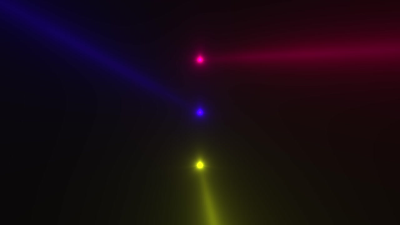 Colorful glowing spotlight beams on black gradient stage