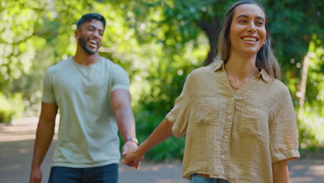 Park,-walking-leading-and-happy-couple-holding