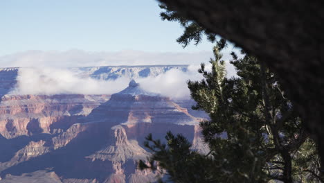 grand canyon with clouds surrounding the iris temple butte in the morning light arizona, usa