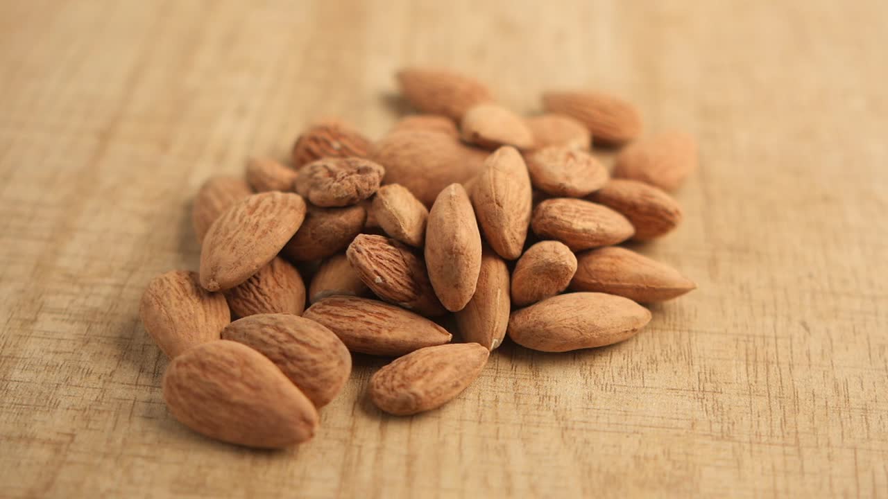 Almonds on a wooden surface